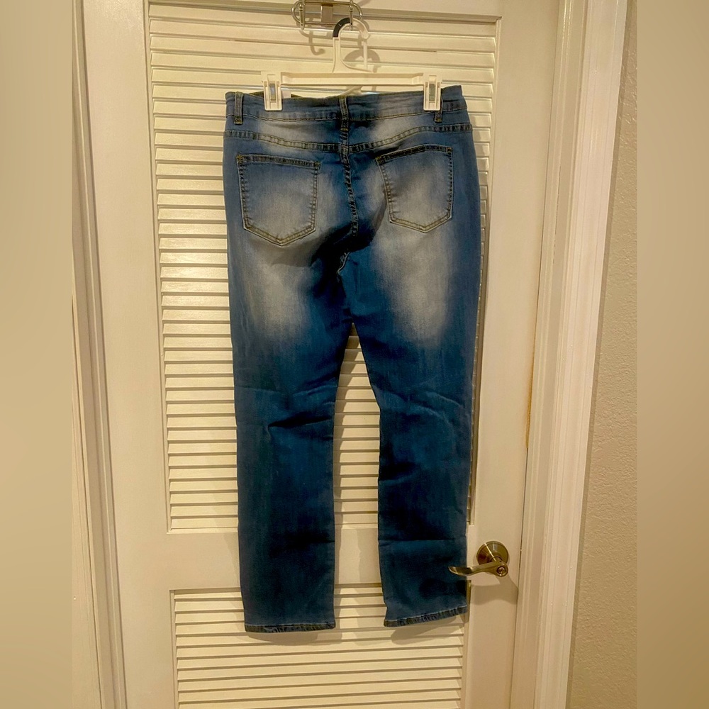 Blue jeans cotton faded and ripped